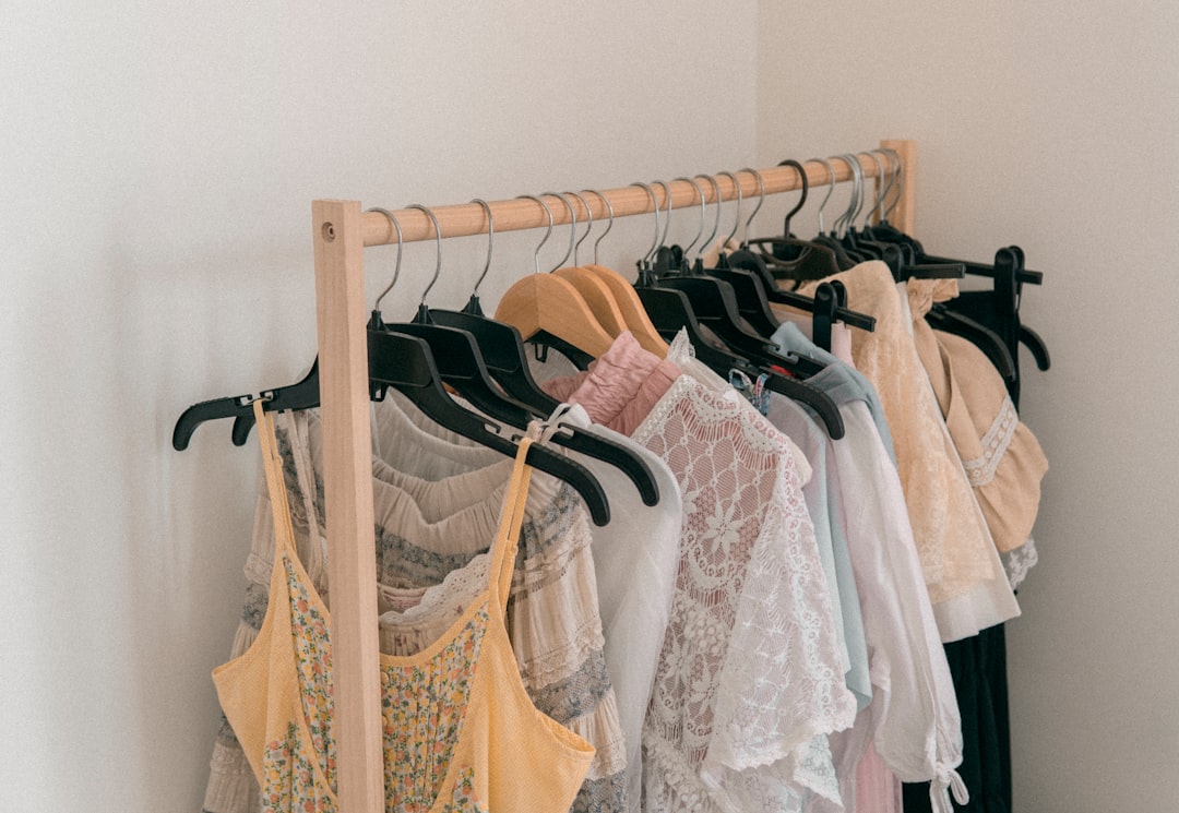 Different types of dresses hanging on a wardrobe rack