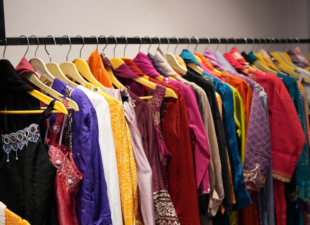 Woman browsing fashion pieces in a boutique
